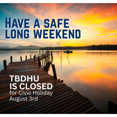 a long dock looking at a sunset with the words 'Have a safe long weekend TBDHU is closed August 3'